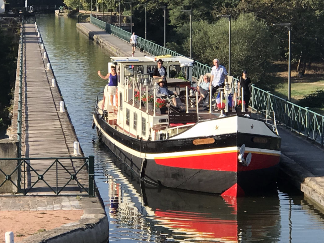 Barge Nilaya crosses the stunning aqueduct at Digoin in France's Burgundy Loire region. Barge Cruises in France